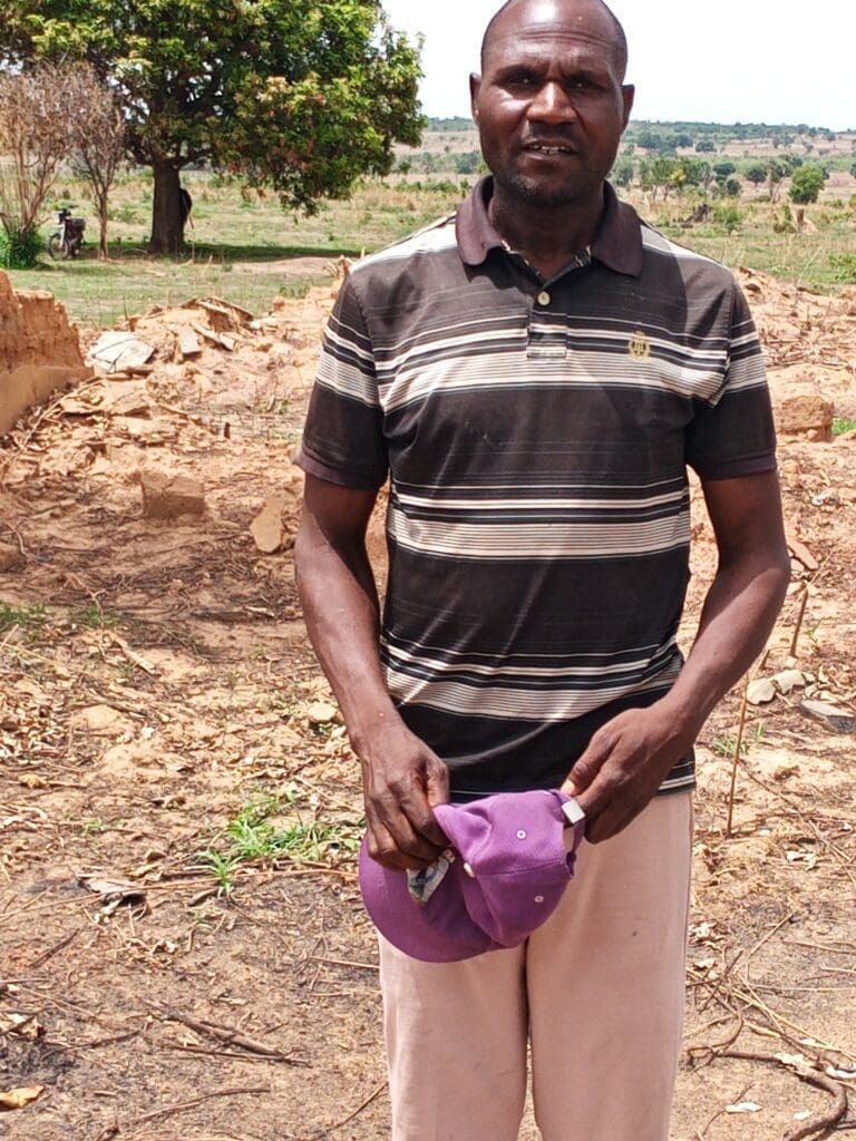 Caleb Nayaro, a native of Rumana, posed for TruthNigeria Monday, visiting his ravaged community for the first time in 6 years (Credit: Luka Binniyat).