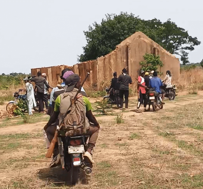The convoy arriving at abandoned church in deserted Malomo Gbagyi village, Chikun County, Monday (Credit: Luka Binniyat)