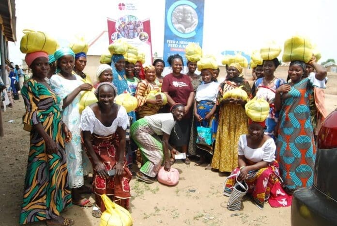 Duile with beneficiaries of CAF support. Photo credit: cafcares.org.
