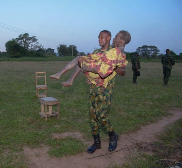Picture showing pastor Obafemi carried by a military personnel. He is one of the kidnap victim rescued by the Nigerian military. Picture Courtesy: Nigeria Military