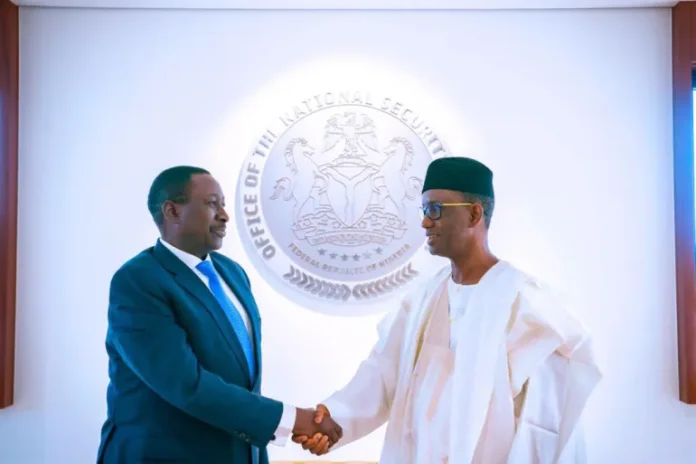 Nuhu Ribadu (r) in a handshake with his immediate predecessor Babagana Monguno on June 26, 2023 [Twitter/@NuhuRibadu]