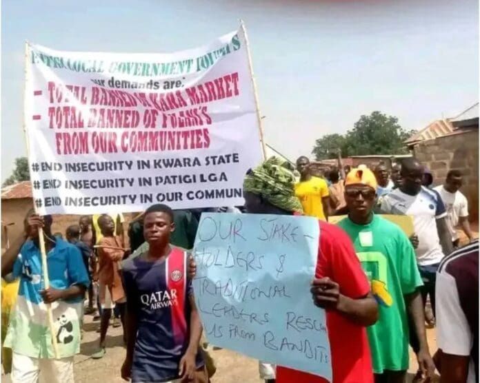 Picture showing placard carrying Patigi county indigenes Kwara state, North-Central Nigeria protesting the invasion of their community by Fulani Ethnic Militia terrorists. Pictures Courtesy: Mallam. Bologi