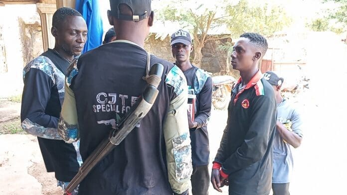 Ezekiel Isa, Member of Community Joint Task Force (CJTF) on far left facing camera. Photo Credit Lawrence Zongo TruthNigeria.