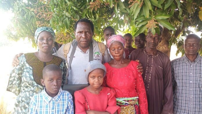 Happiness Dauda (at the center in red dress ) of Angwan Mission , Mararaban Kajuru. Happiness, a 12-year-old Adara Christian girl, was threatened by armed men pointing guns at her and demanding to know her mother’s whereabouts. Photo by Mike Odeh James.
