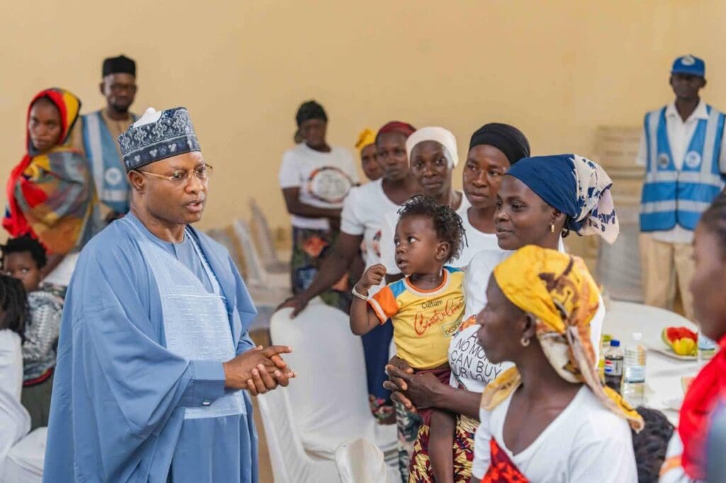 Governor Uba Sani of Kaduna State (in blue embroidery cap and flowing gown) speaking to some of Kurmin Wali Villagers at Kaduna Children Centre, Kaduna, Wednesday. They were taken there after escaped being kidnapped and  spent over ten days wondering in the bushes and taking shelter among other communities before returning to Kurmin Walli (Credit: Uba Sani Facebook)