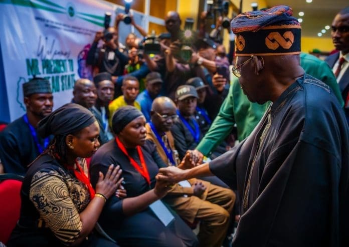 President Tinubu comforts widows of recent violence in Jos, during visit on April 4th. Courtesy President Tinubu [facebook]