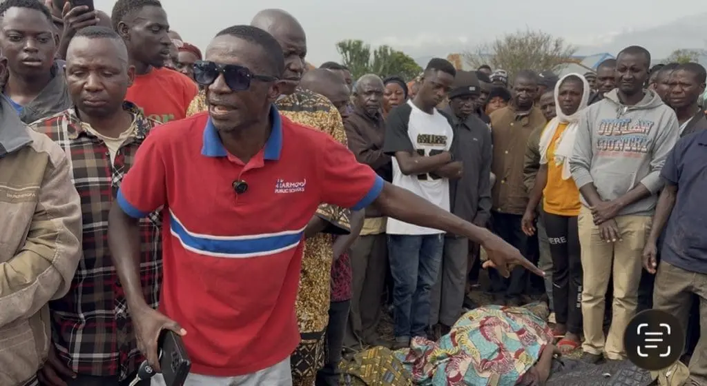 Solomon Dalyop, a Plateau community leader points to the bodies of seven victims of a Monday evening attack |Credit Masara Kim/TruthNigeria.