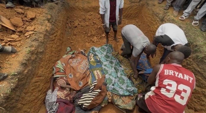 Locals arrange bodies of seven victims killed Monday evening in Nding Sesut in a shallow grave on Tuesday amid ongoing attacks. Credit Masara Kim/TruthNigeria.