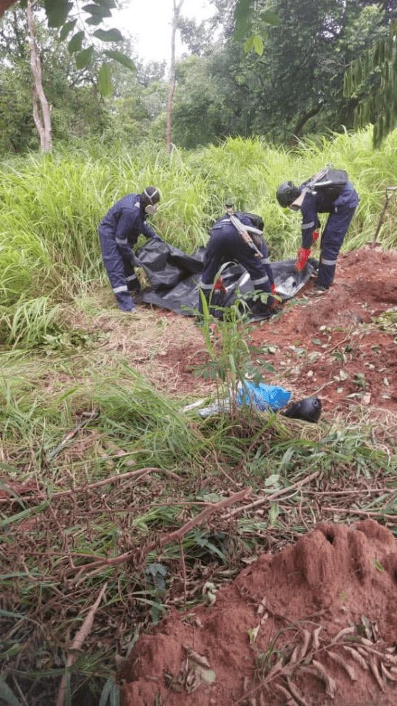 Security agents exhuming corpse of Kachalla Ibrahim Battijo in Kogi forest. Picture Courtesy: Nigerian Military.