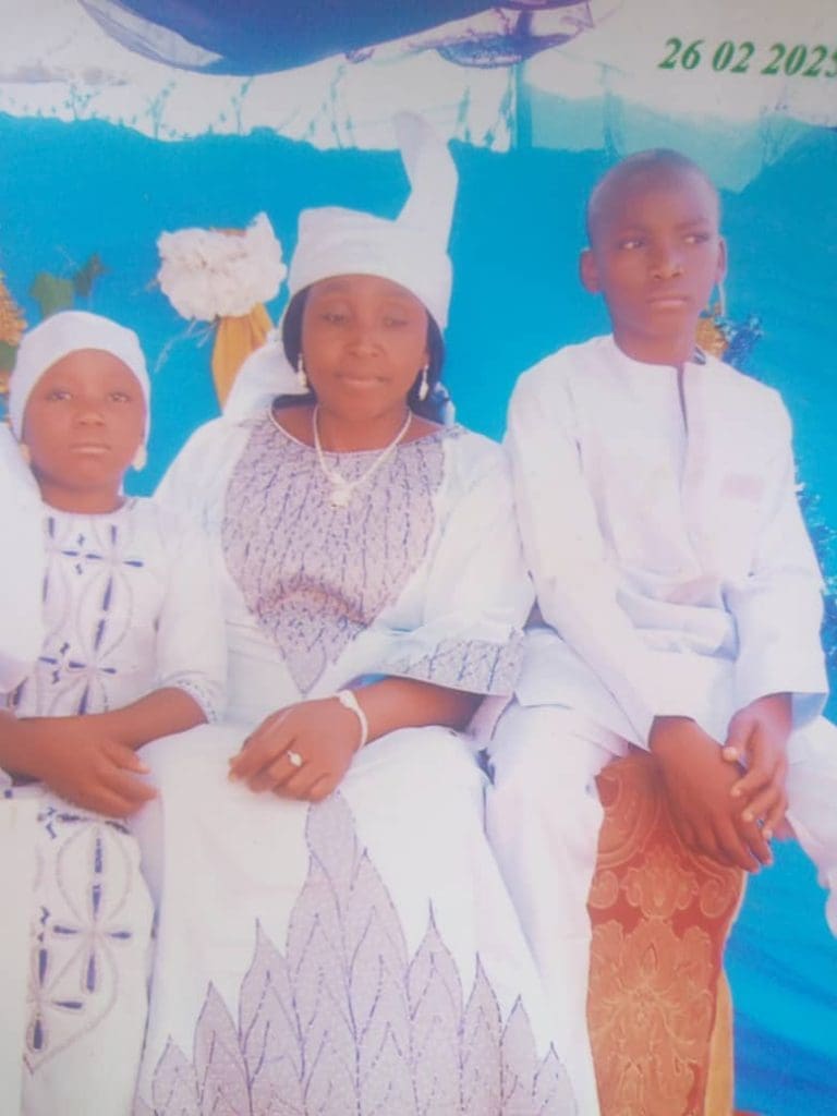 Mrs Martha Dauda, 52, with her children, Yakubu now 14, and Celina, now 9, in 2024 (Credit: Malik Gana)